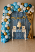Blue white and golden birthday decoration set with balloons, net curtains and fairy lights
