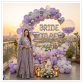Royal purple bride decoration with premium purple balloons, Bride To Be foil balloons, elegant balloon arch, and luxury bridal shower décor.