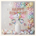 Pastel unicorn birthday decoration with rose gold Happy Birthday foil balloons, giant unicorn foil balloon, rainbow decorations, daisy balloons and pastel balloon arch backdrop.