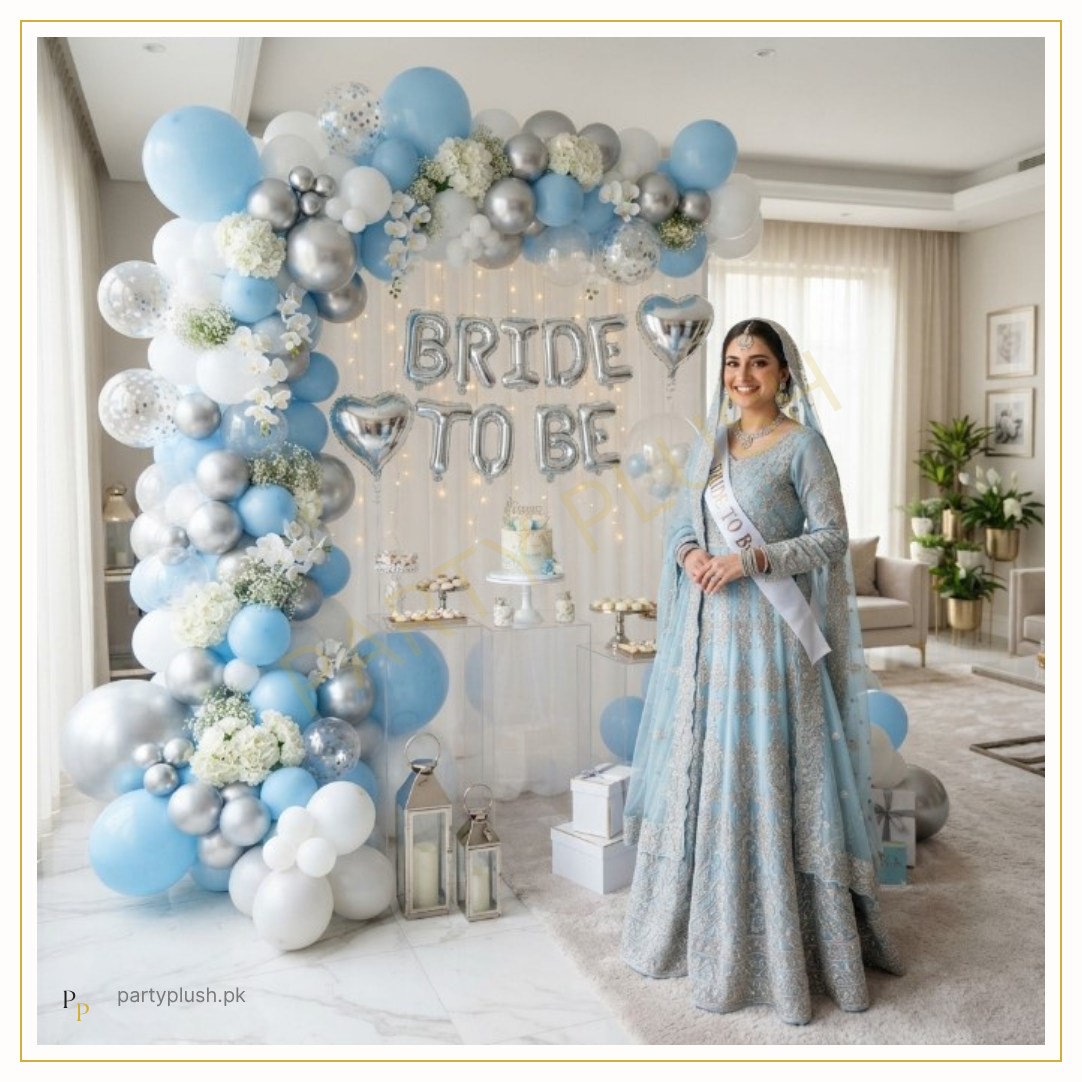 Sky Blue Elegance Bride decoration with sky blue, white and silver balloon arch, Bride To Be foil letters, silver heart foil balloons and elegant bridal shower setup.